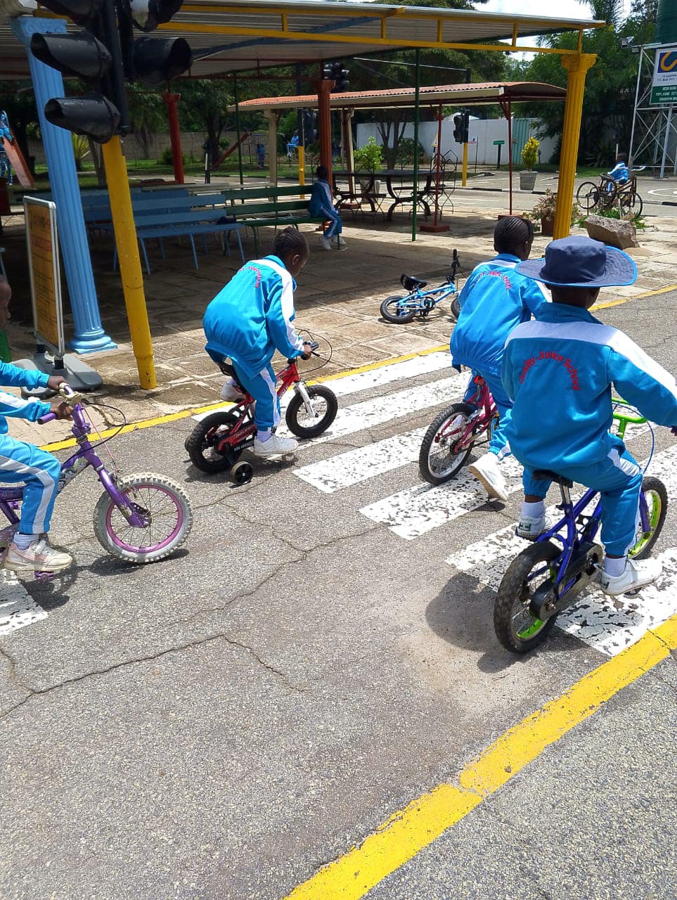 Junior pupils learning road safety on the campus traffic course